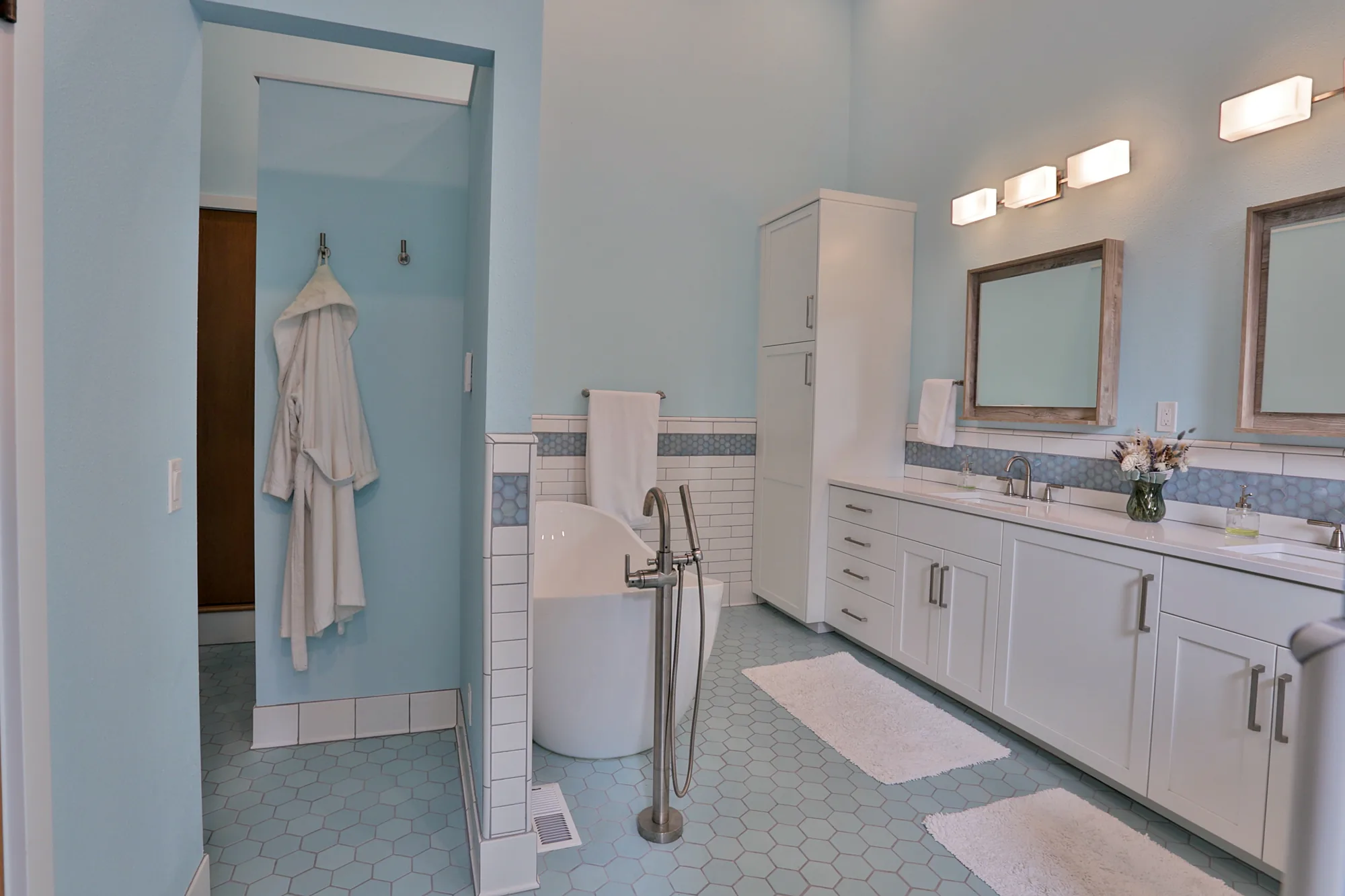 Walk-in shower with natural stone in Portland bathroom remodel